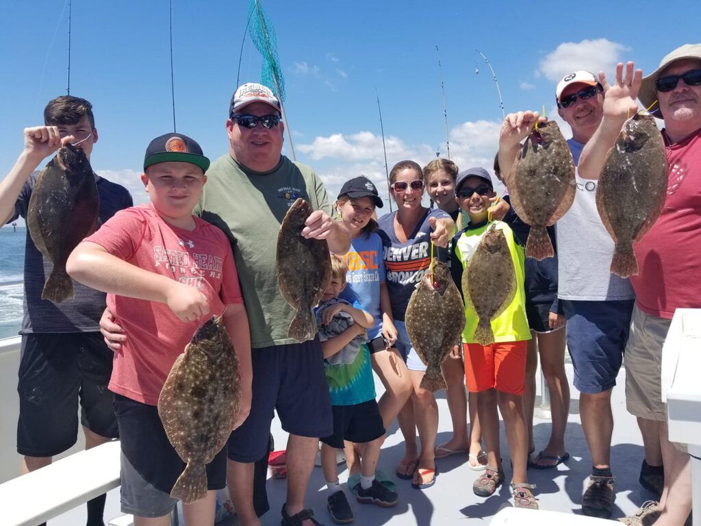 family holding fishes